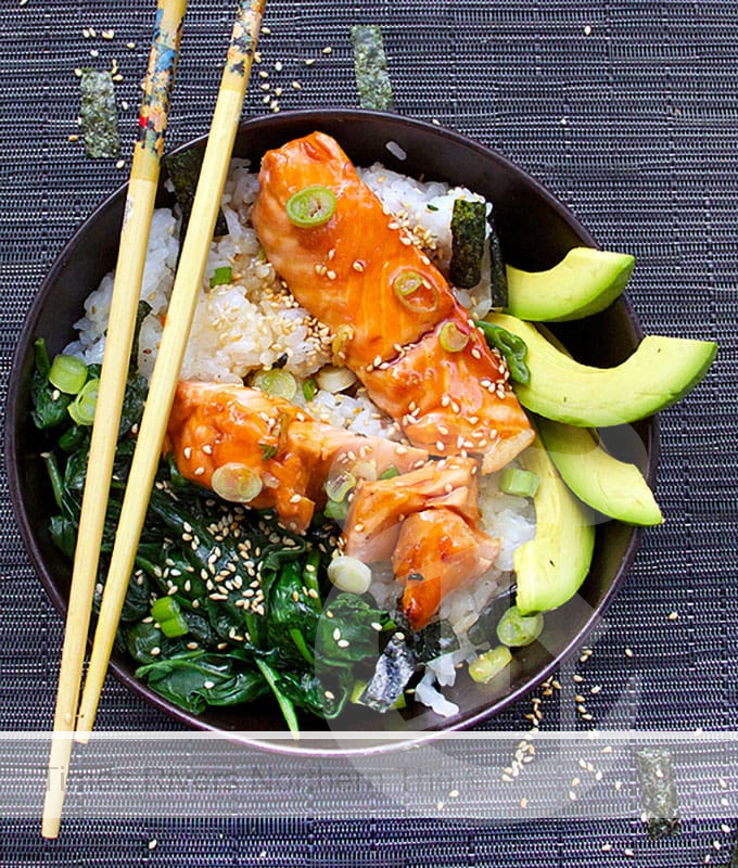 Teriyaki salmon rice bowl with spinach and avocado