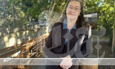 A photo of Denise Galle leaning on a bridge.