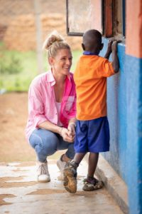 A women talking to a child in Kenya