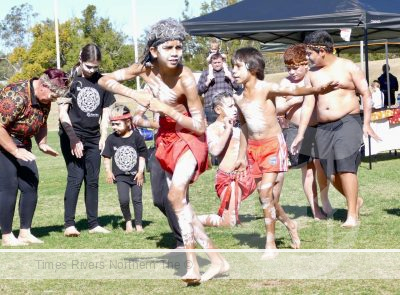 Young Aboriginal boys doing a cultural dance for NAIDOC