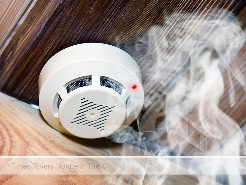 White smoke alarm in wooden room