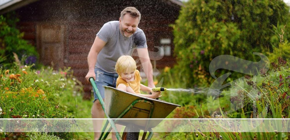A father gardening with his children.