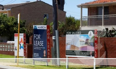 A house with a for lease sign out the front.