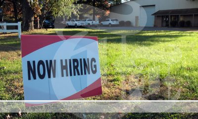A now hiring sign as unemployment hits a high