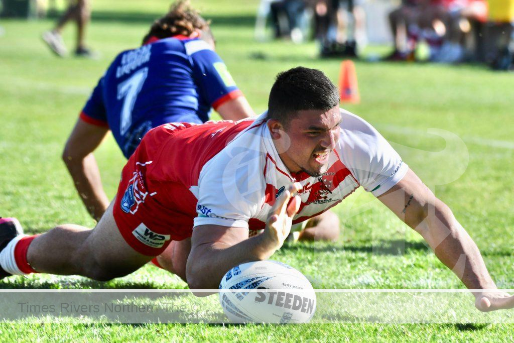Rebels centre James Torrens crosses for his second try of the game during the Rebels 34-16 preliminary final win over the Nambucca Roosters on Sunday. Photo: Gary Nichols.