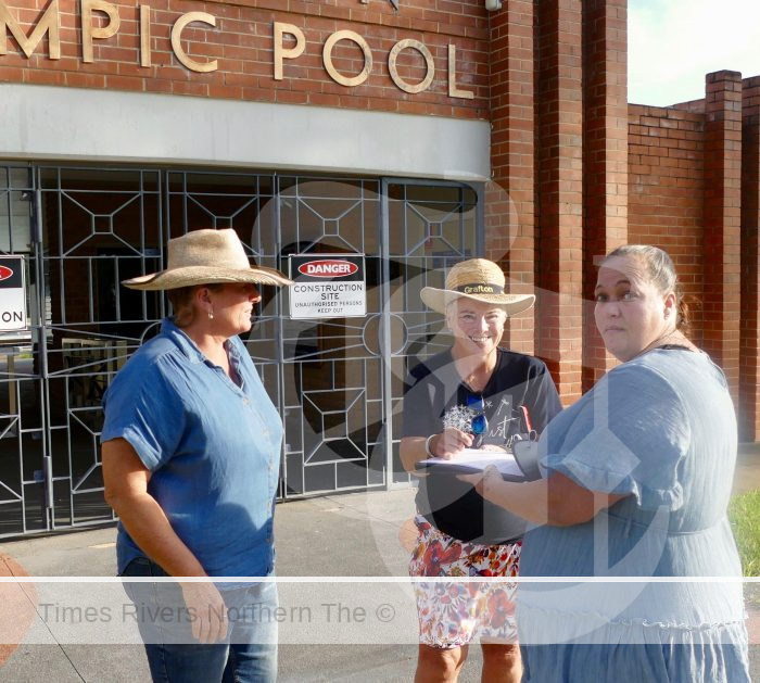 Grafton mum and pool user Karina Plunkett gets the signatures of Heidi Mackay, left and Jenny Vickery, centre, on a petition calling for Clarence Valley Council to cease delays on the Grafton Aquatic Centre project.