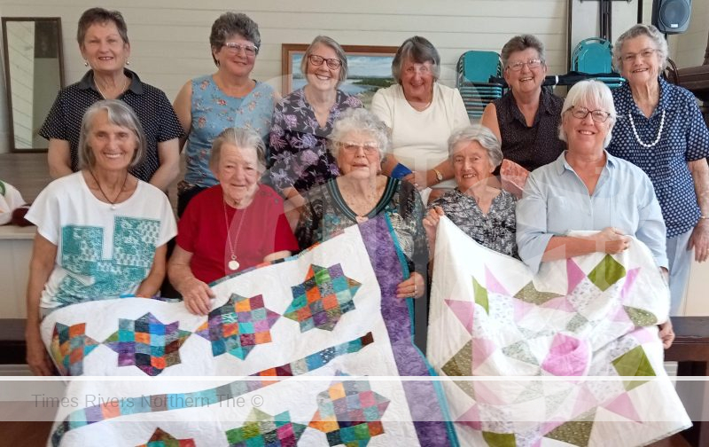 Bluff Point Quilters relax after massive exhibition.