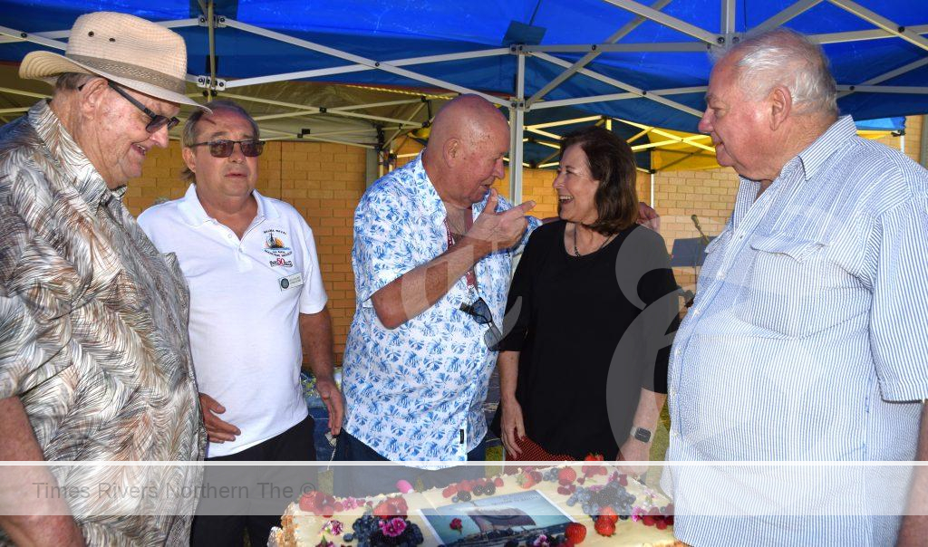L to R: Col from the Idaho, Dick Greaves, President, Ballina Naval & Maritime Museum, Las Balsas expeditioner Fern Robichaud, Ballina mayor Sharon Cadwallader, Brock from the Enterprise ready to cut the cake.
