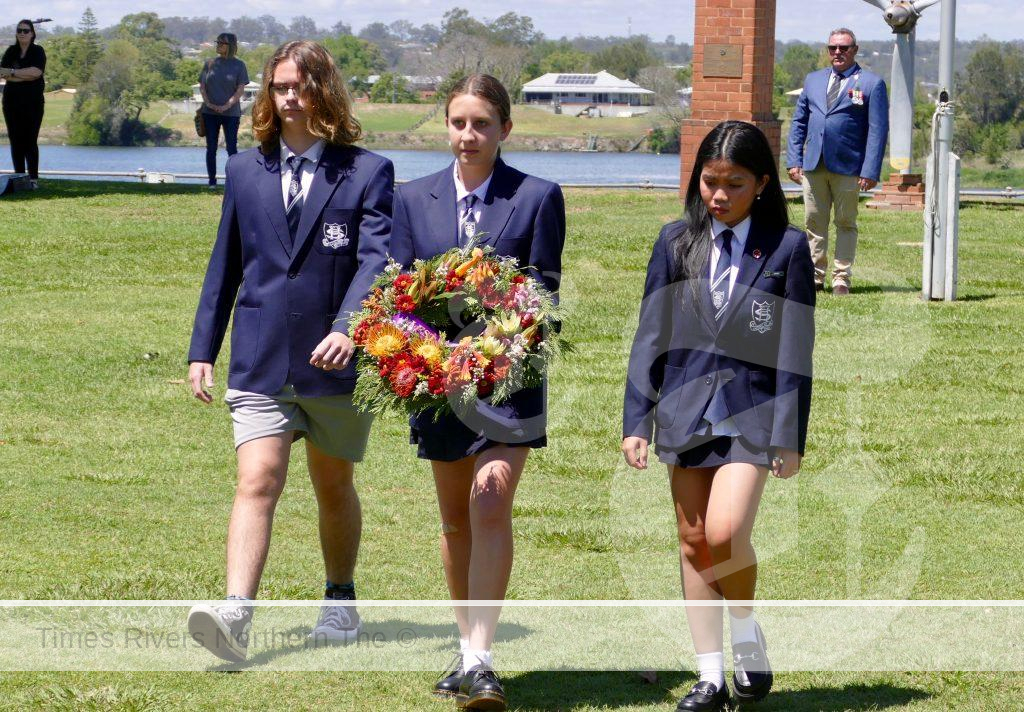 Student leaders from Clarence Valley Anglican School carry a wreath to the Grafton Cenotaph during Saturday’s Remembrance Day Service.