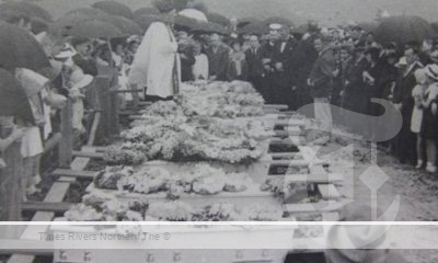 The sombre scene at the graveside in South Grafton when nine of the Cub Scouts who drowned in the Clarence River were buried. Photo: Clarence River Historical Society.