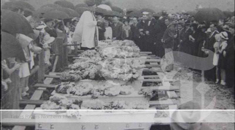 The sombre scene at the graveside in South Grafton when nine of the Cub Scouts who drowned in the Clarence River were buried. Photo: Clarence River Historical Society.