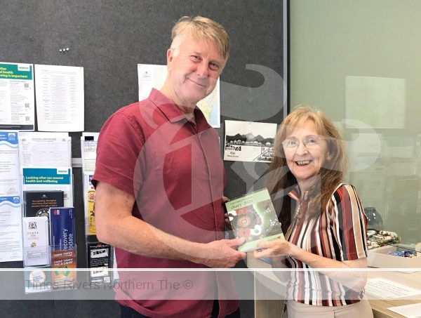 FREE DIARY: Senior Ted receives a 2024 Legal Aid Diary from Janelle Saffin MP for the NSW Seniors Festival.