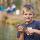 OzFish fishing day, child holding carp at the Kyogle Carp Out