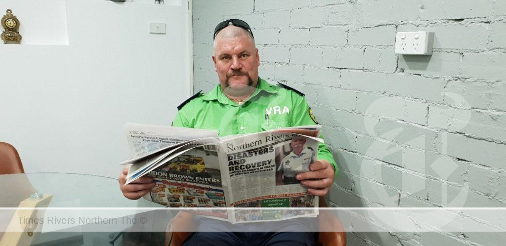 Paul Cowles reading the Northern Rivers Times