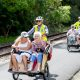 The Cycling Without Age trishaws in action at the community celebration weekend to mark the opening of the Rail Trail in March 2023.
