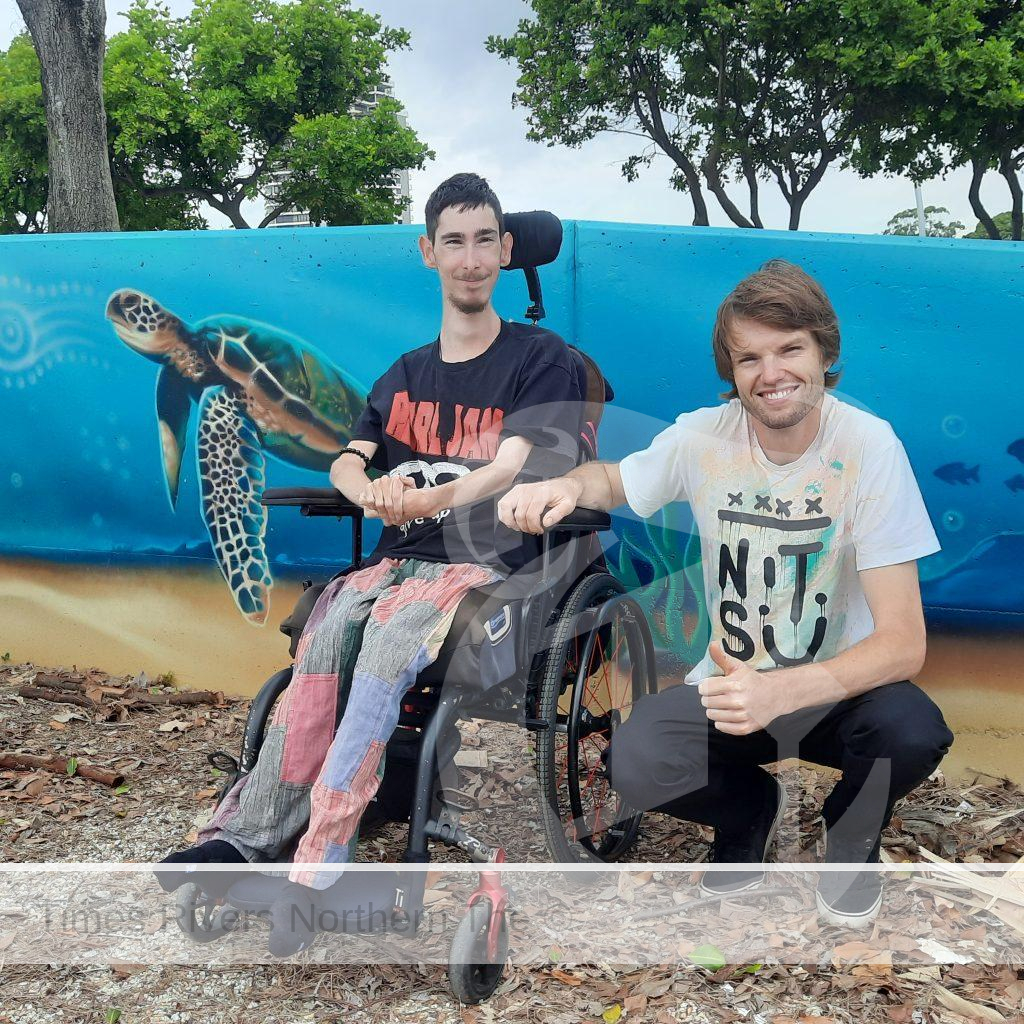 Banora Point resident Kyle Sculley, left, with local artist Michael Shmick, who painted the mural at the new youth recreation area at Jack Evans Boat Harbour in Tweed Heads - Goorimahbah