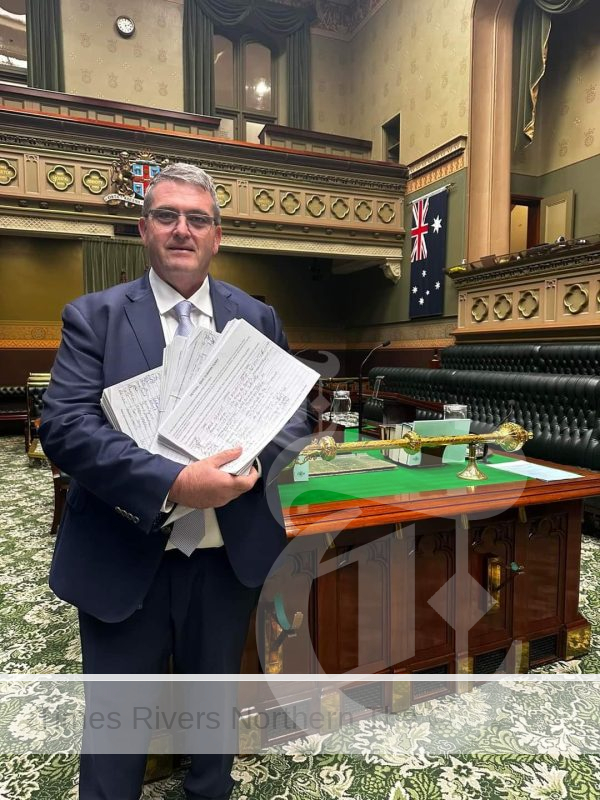 The Member for Clarence Richie Williamson in NSW Parliament with petitions containing 6000 signatures, to save the Ulmarra Ferry, which will be decommissioned on June 10.