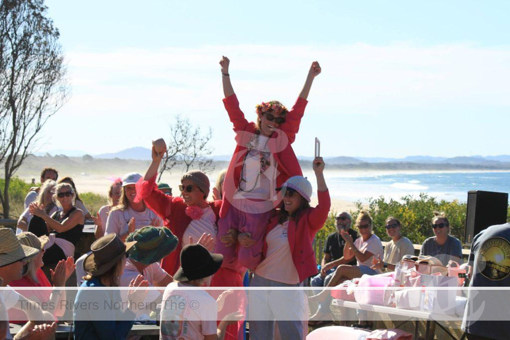 Emma Perrier being lifted up at the beach