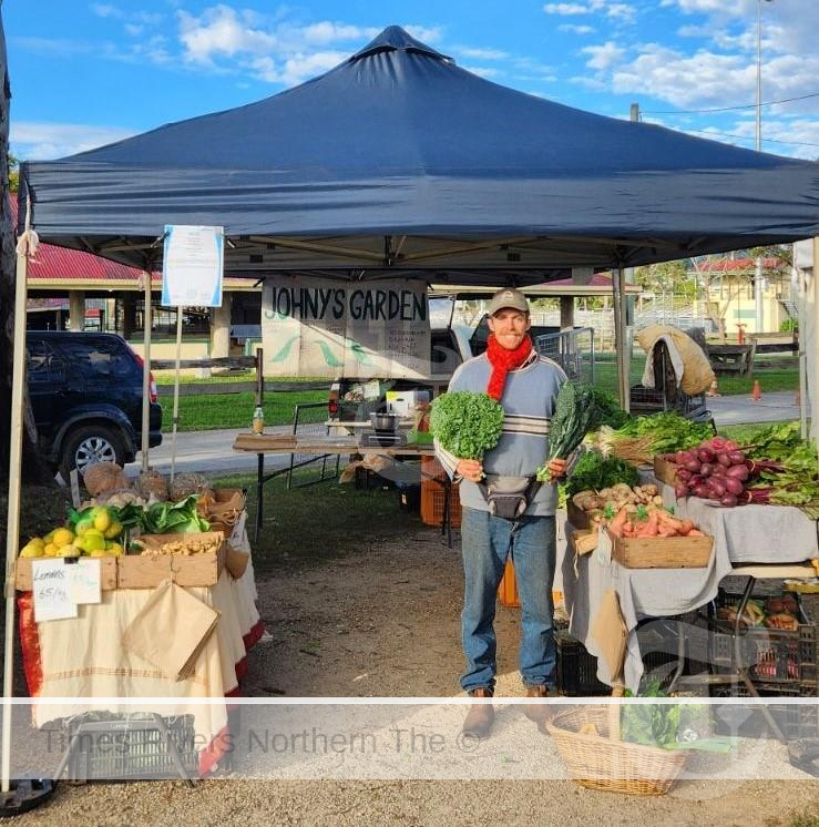 Toby O'Grady selling produce at the Murwillumbah Farmers Markets