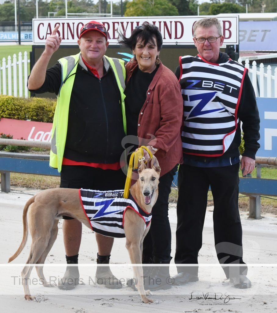 Butcher with his owners Courtesy Casino Greyhound Racing Club Facebook page