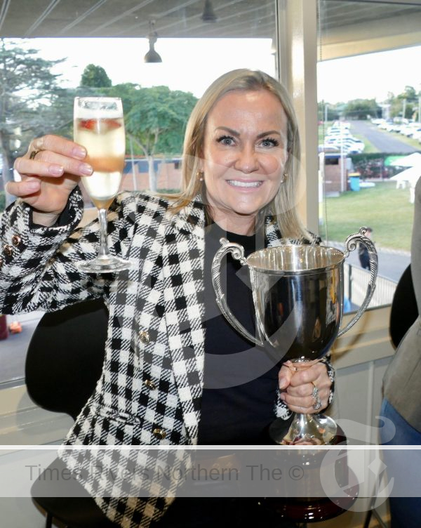 Maree Anderson, a part owner of South Grafton Cup winner Cepheus, celebrates in the Winner's Room at the Clarence River Jockey Club on Sunday.