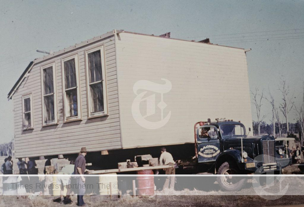 A. C. Coopers truck from Mallanganee moving the Bottle Creek School to Tunglebung to be used as their Hall- 1964