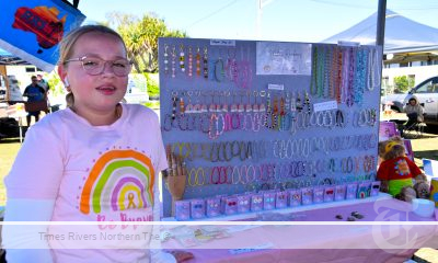 Millie Trustum with the jewellery she designed, that she sells at her market stall.