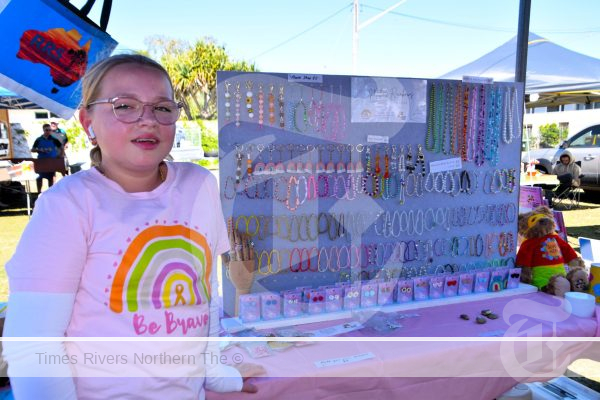 Millie Trustum with the jewellery she designed, that she sells at her market stall.