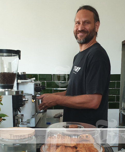 Damo Robertson, owner of Little Stray, behind the coffee machine in Woodburn.